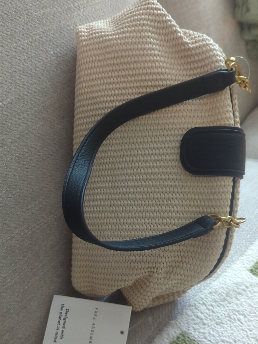 Woven Cream Shoulder Bag with Black Trim and Gold Accents